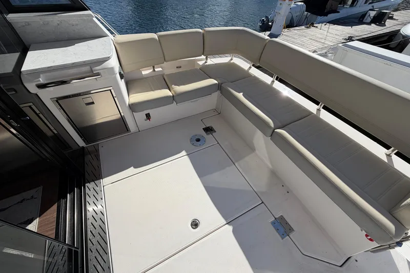 Slide: The Image of Luxurious seating area on 2019 Regal 42 Grande Coupe yacht deck. - 15