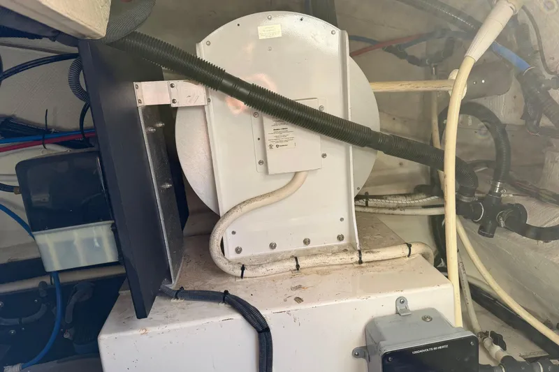 Slide: The Image of Engine room of a 2019 Regal 42 Grande Coupe with visible wiring and components. - 22