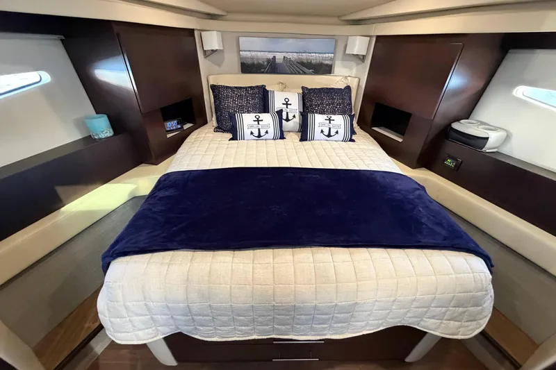 Slide: The Image of Luxurious bedroom interior of 2019 Regal 42 Grande Coupe yacht with nautical-themed decor. - 26