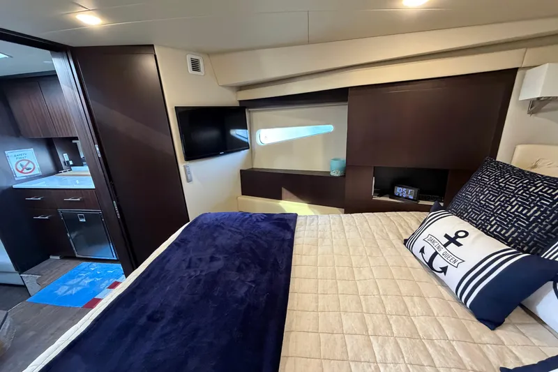 Slide: The Image of Luxurious interior of 2019 Regal 42 Grande Coupe yacht with cozy bedroom and modern amenities. - 27