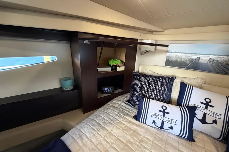 Slide: The Image of Luxurious interior of 2019 Regal 42 Grande Coupe with nautical-themed decor. - 28