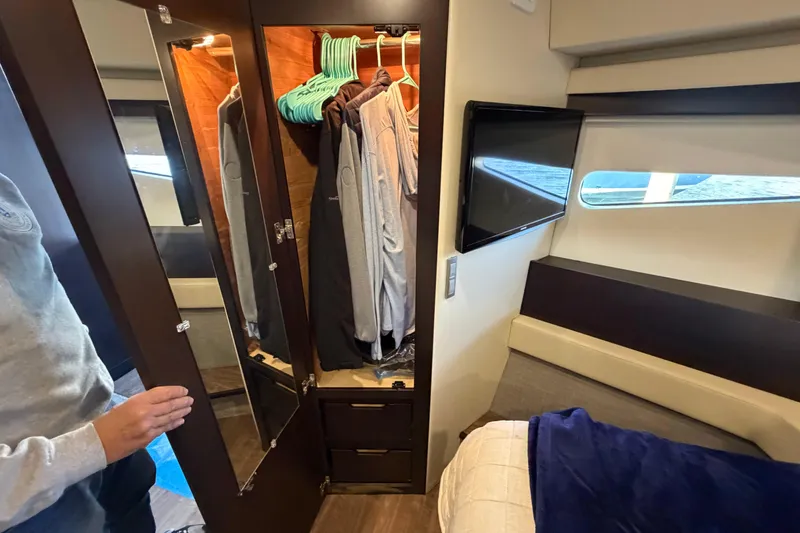 Slide: The Image of Interior of 2019 Regal 42 Grande Coupe with wardrobe, TV, and bed. - 30