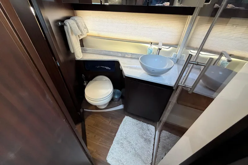 Slide: The Image of Luxurious bathroom in 2019 Regal 42 Grande Coupe yacht with modern fixtures and elegant design. - 32