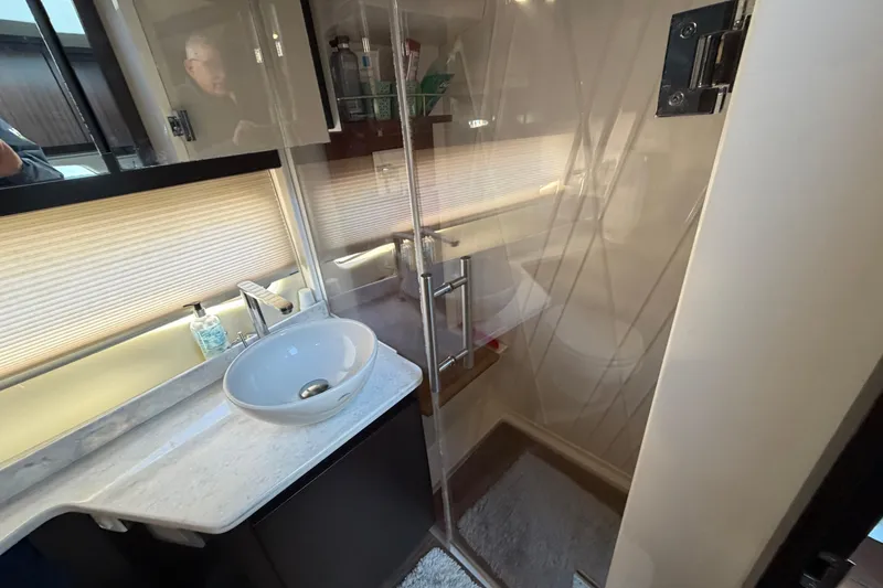 Slide: The Image of Luxurious bathroom interior of 2019 Regal 42 Grande Coupe yacht with modern fixtures. - 33