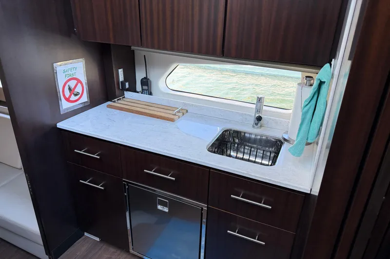 Slide: The Image of Luxurious galley in 2019 Regal 42 Grande Coupe yacht with modern amenities. - 35