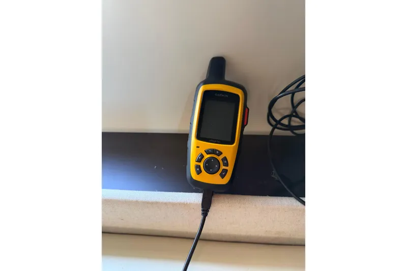 Slide: The Image of Yellow Garmin GPS device on a 2019 Regal 42 Grande Coupe yacht. - 38