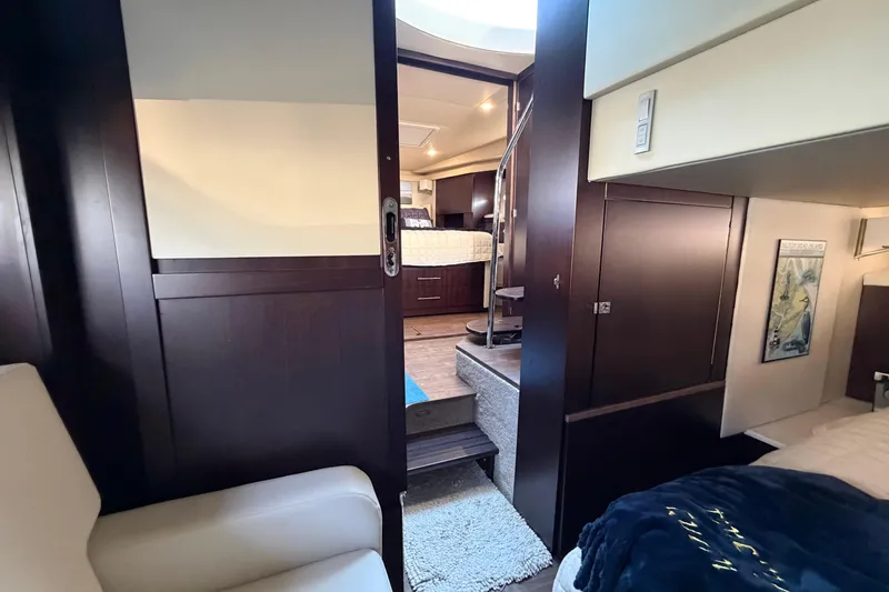 Slide: The Image of Interior of 2019 Regal 42 Grande Coupe yacht, featuring modern design and cozy furnishings. - 42