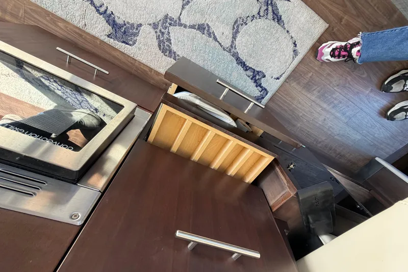 Slide: The Image of Interior view of 2019 Regal 42 Grande Coupe kitchen area with open drawers and modern design. - 48