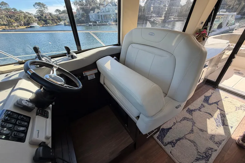 Slide: The Image of Helm of 2019 Regal 42 Grande Coupe with leather seat and steering wheel. - 51