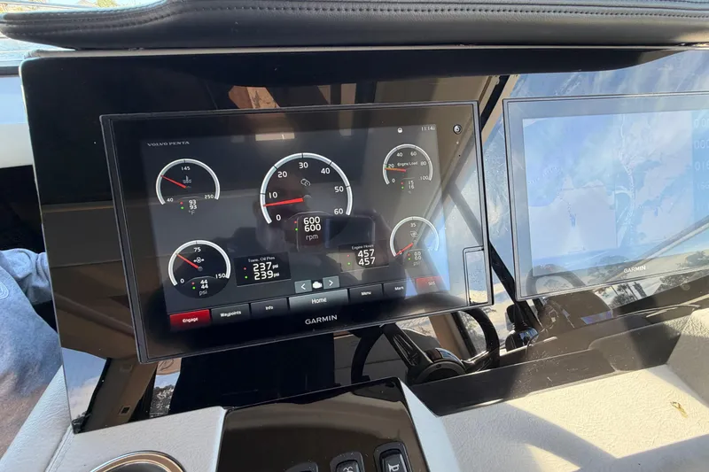 Slide: The Image of Dashboard of 2019 Regal 42 Grande Coupe with Garmin display and engine gauges. - 52