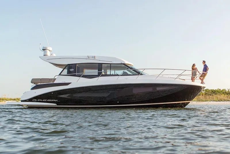Slide: The Image of Manufacturer Provided Image: 2019 Regal 42 Grande Coupe yacht on water with two people on deck. - 67