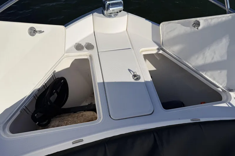 Slide: The Image of 2019 Regal 42 Grande Coupe boat storage compartments with open hatches. - 9