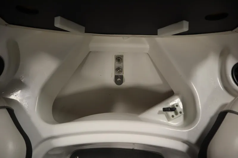 Slide: The Image of Interior view of a 2013 Yamaha AR190 boat compartment, showcasing storage space. - 13