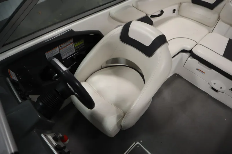 Slide: The Image of 2013 Yamaha Boats AR190 interior with white seating and steering wheel. - 22