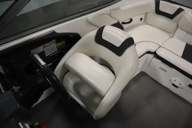 Slide: The Image of 2013 Yamaha AR190 boat interior with white seating and steering wheel. - 23