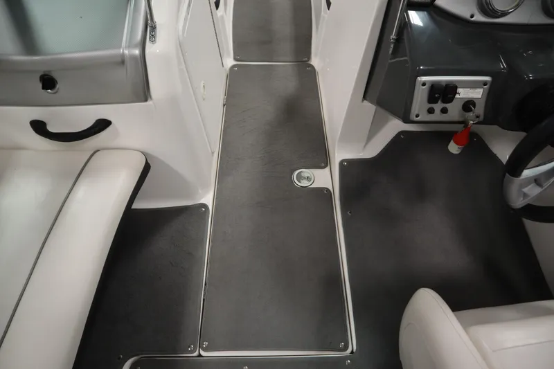 Slide: The Image of 2013 Yamaha Boats AR190 interior showing seating and control panel. - 24