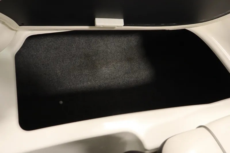 Slide: The Image of Storage compartment of a 2013 Yamaha Boats AR190, featuring a spacious interior. - 34