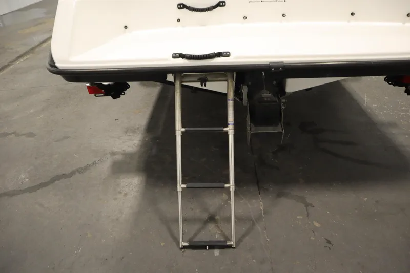 Slide: The Image of 2013 Yamaha AR190 boat with extended swim ladder on concrete floor. - 37