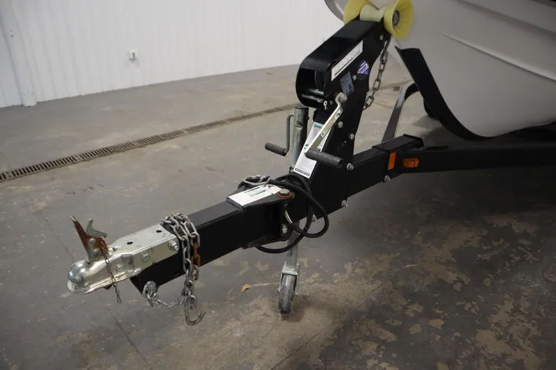 Slide: The Image of Trailer hitch of a 2013 Yamaha Boats AR190, featuring chains and a wheel. - 38