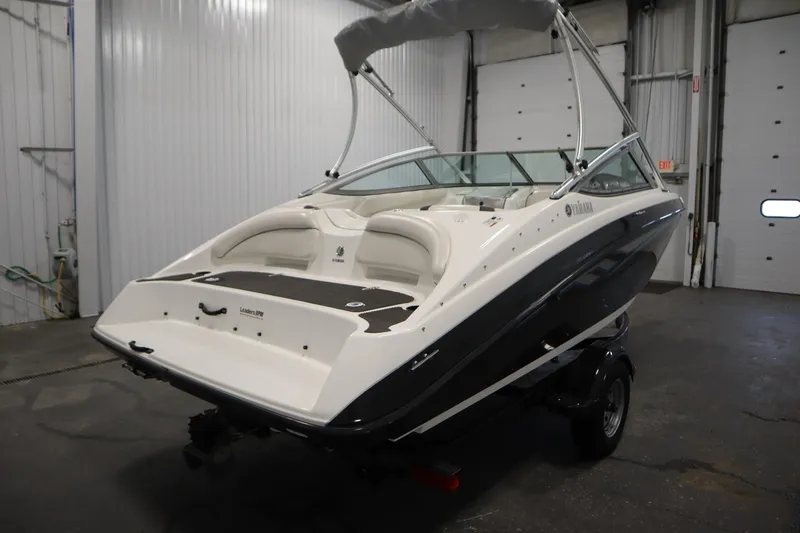 Slide: The Image of 2013 Yamaha Boats AR190 in a garage, showcasing sleek design and modern features. - 5