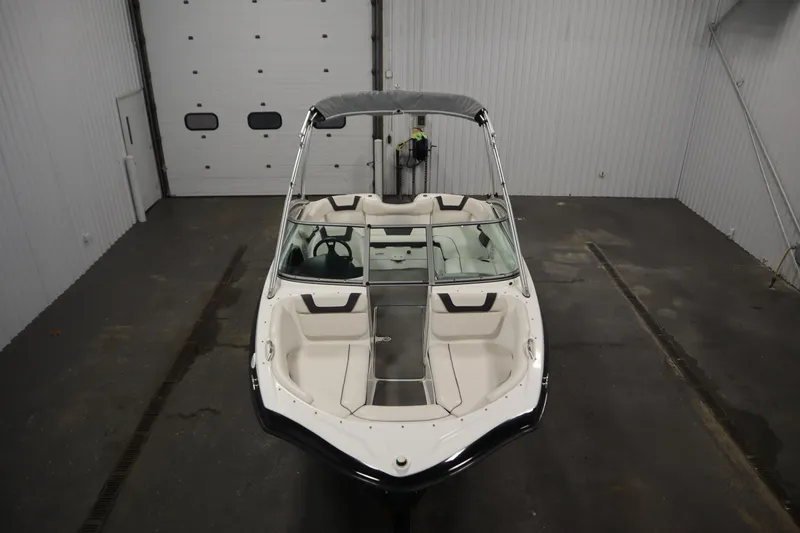 Slide: The Image of 2013 Yamaha Boats AR190 in a garage, top view showcasing interior and design. - 9