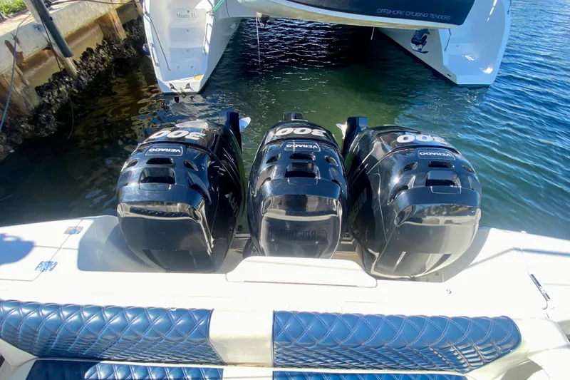 Slide: The Image of Triple Mercury outboard engines on a 2000 Intrepid 377 Walkaround boat. - 24