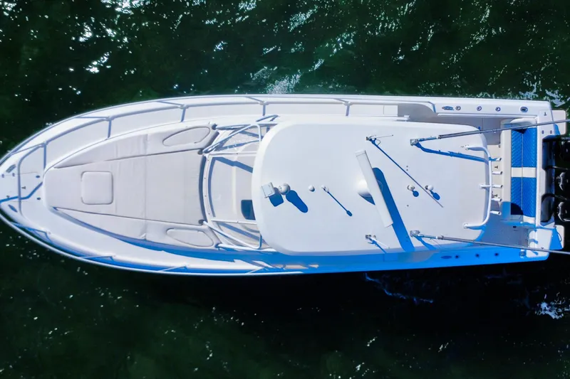 Slide: The Image of 2000 Intrepid 377 Walkaround boat on open blue sea. - 3