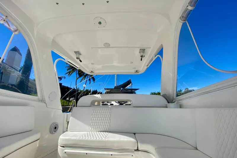 Slide: The Image of Luxurious interior of 2000 Intrepid 377 Walkaround boat with white seating and blue sky. - 41