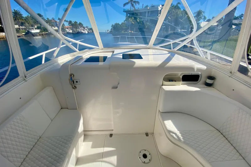 Slide: The Image of 2000 Intrepid 377 Walkaround boat deck with hatches, overlooking water. - 43