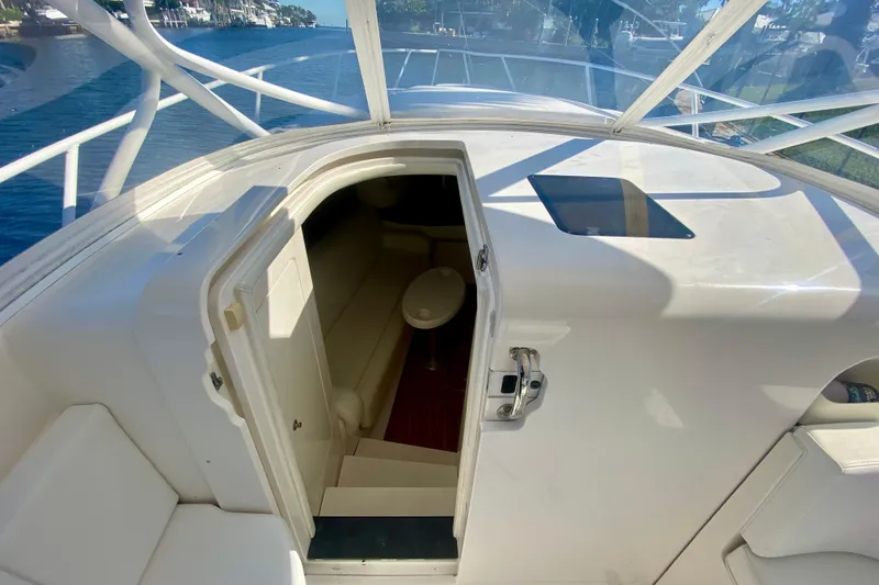Slide: The Image of Interior of 2000 Intrepid 377 Walkaround boat with seating and table. - 45