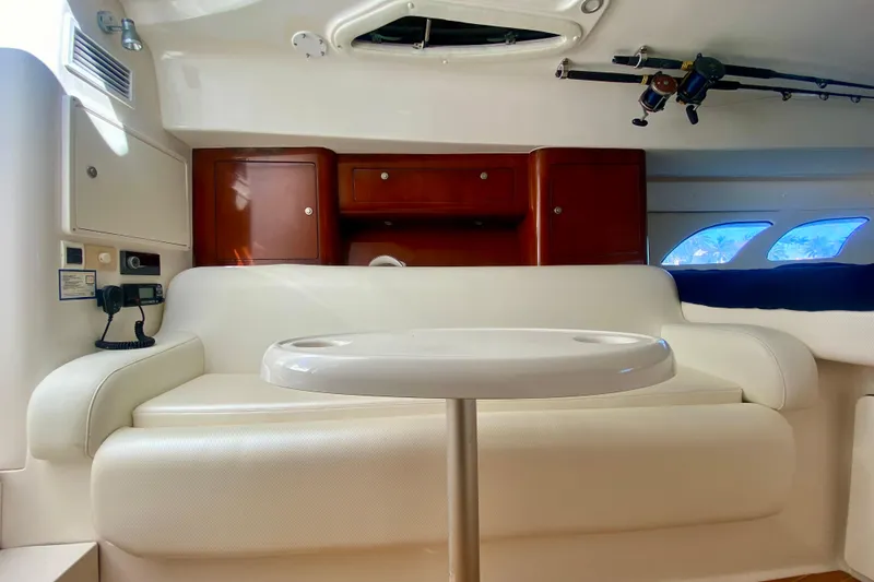 Slide: The Image of Interior of 2000 Intrepid 377 Walkaround boat with cozy bed and seating area. - 49