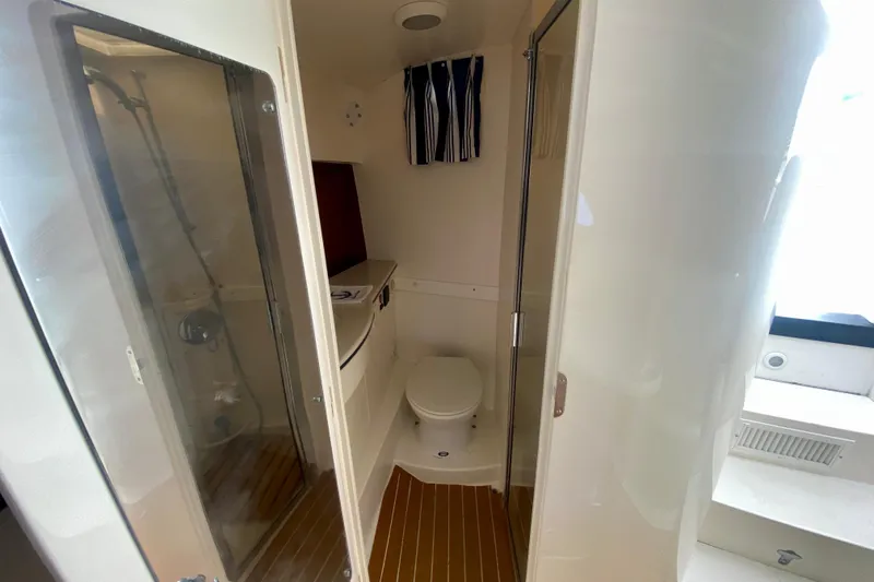 Slide: The Image of Bathroom interior of 2000 Intrepid 377 Walkaround with sink, toilet, and shower. - 56