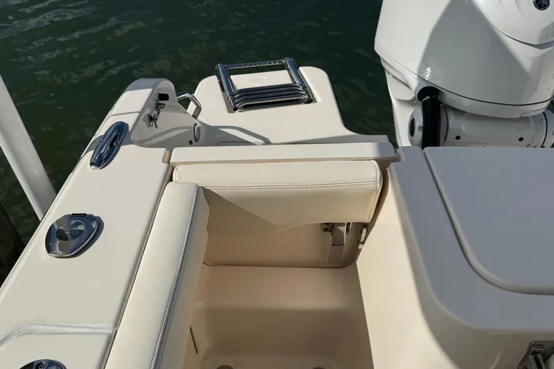 Slide: The Image of 2023 Grady-White Fisherman 236 boat interior with seating and motor details. - 11