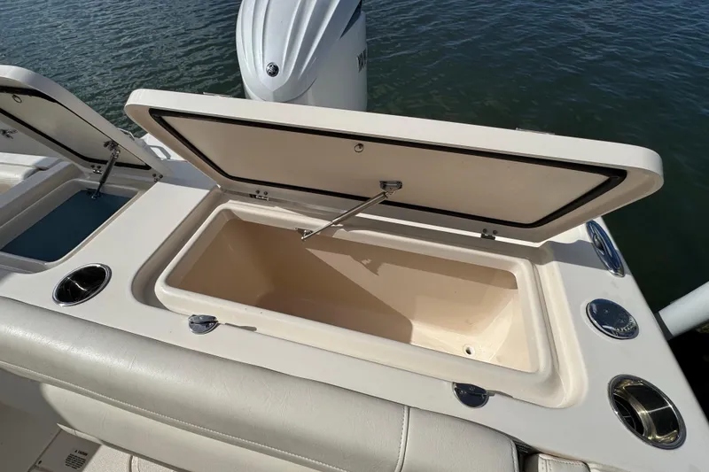 Slide: The Image of 2023 Grady-White Fisherman 236 boat with open storage compartment on deck. - 14