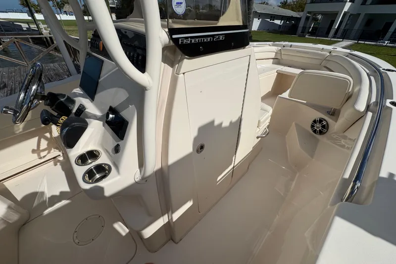 Slide: The Image of 2023 Grady-White Fisherman 236 boat interior with steering console and seating area. - 36