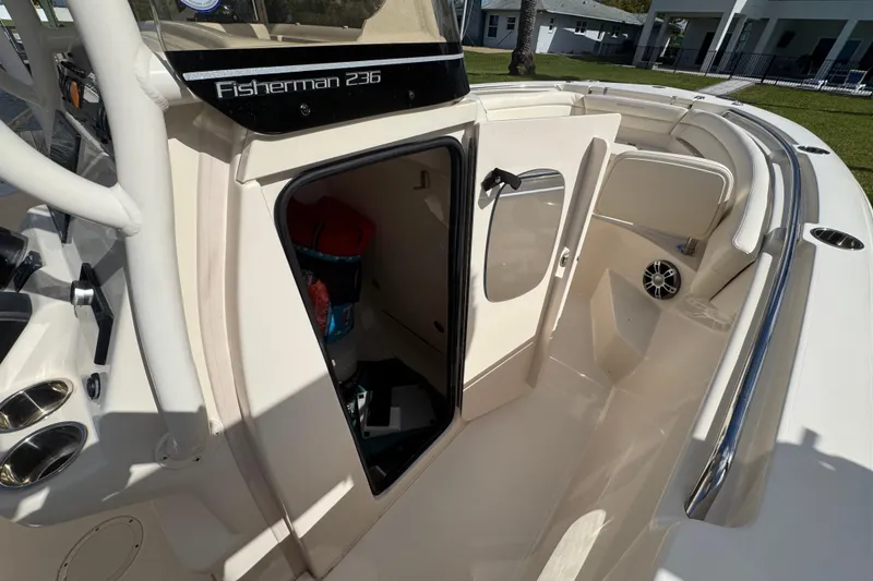 Slide: The Image of 2023 Grady-White Fisherman 236 boat interior with open storage compartment and seating area. - 37