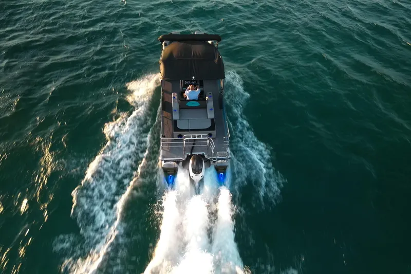 Slide: The Image of Aerial view of Vision Marine Technologies V30 boat cruising on open water, 2025 model. - 3