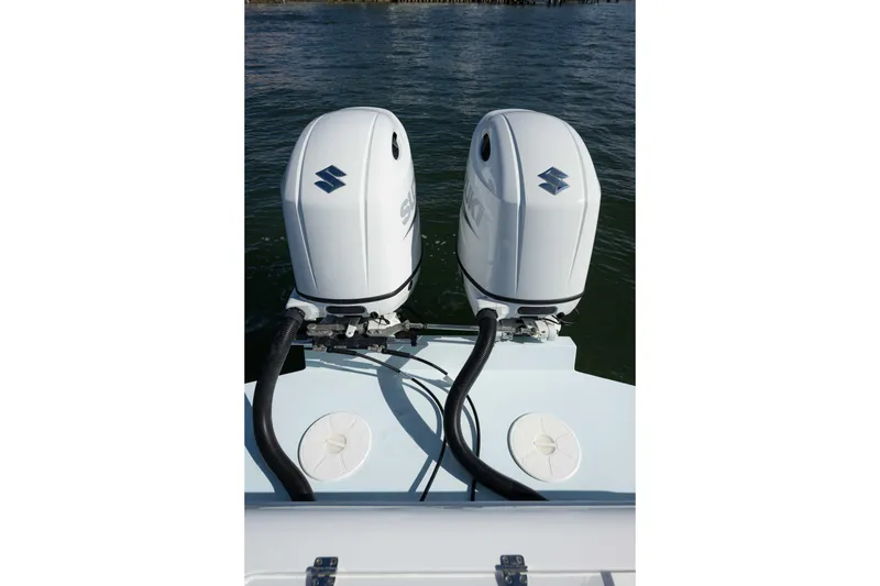 Slide: The Image of Twin Suzuki outboard engines on 2024 Bluewater 2550 boat, viewed from the rear. - 20