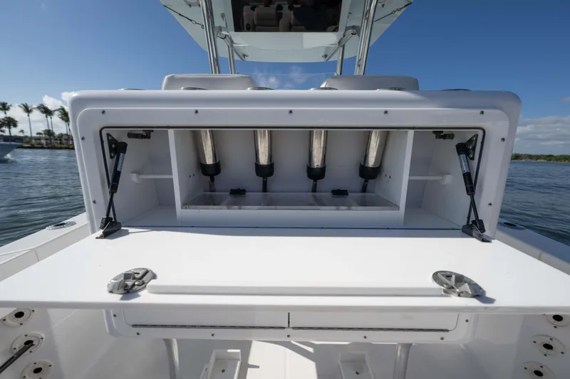 Slide: The Image of 2024 Bluewater 2550 boat with open storage compartment, showcasing sleek design and functionality. - 24