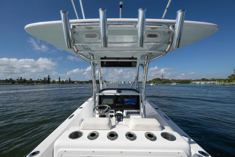 Slide: The Image of 2024 Bluewater 2550 boat dashboard with ocean view and clear blue sky. - 25