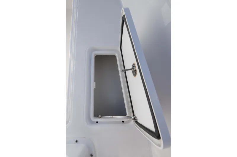 Slide: The Image of Open storage compartment on 2024 Bluewater 2550 boat, showcasing interior details. - 30
