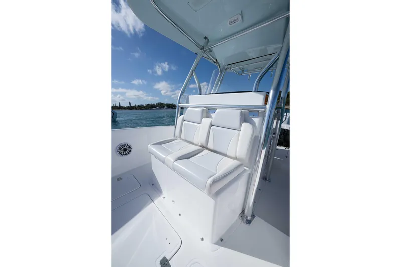 Slide: The Image of 2024 Bluewater 2550 boat interior with white seating and stainless steel frame. - 43