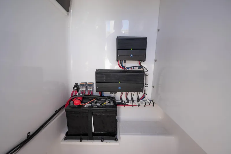 Slide: The Image of 2024 Bluewater 2550 boat electrical system with batteries and wiring setup. - 51