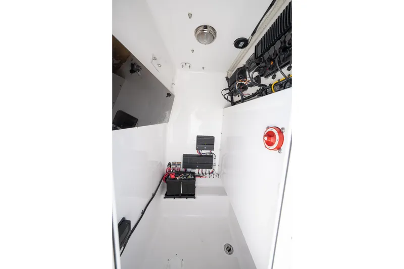 Slide: The Image of 2024 Bluewater 2550 boat interior showing electrical components and wiring setup. - 53