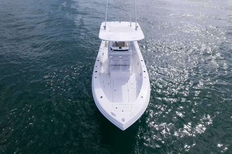 Slide: The Image of 2024 Bluewater 2550 boat on open water, aerial view. - 9