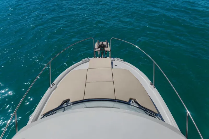 Slide: The Image of 2024 Beneteau America Antares 8 boat bow on open water. - 1