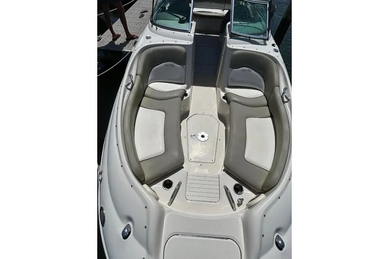 Slide: The Image of 2006 Sea Ray 240 Sundeck boat interior with spacious seating and open deck. - 4