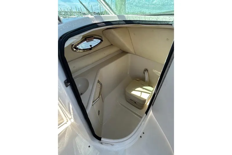 Slide: The Image of Interior of 2006 Sea Ray 240 Sundeck boat with compact toilet. - 5