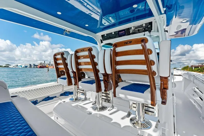 Slide: The Image of Luxury seating on 2025 HCB 53 Suenos RXV boat, featuring elegant design and ocean backdrop. - 22
