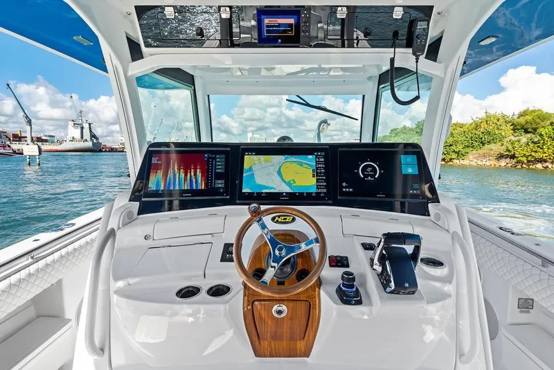 Slide: The Image of 2025 HCB 53 Suenos RXV boat cockpit with advanced navigation displays and controls. - 24